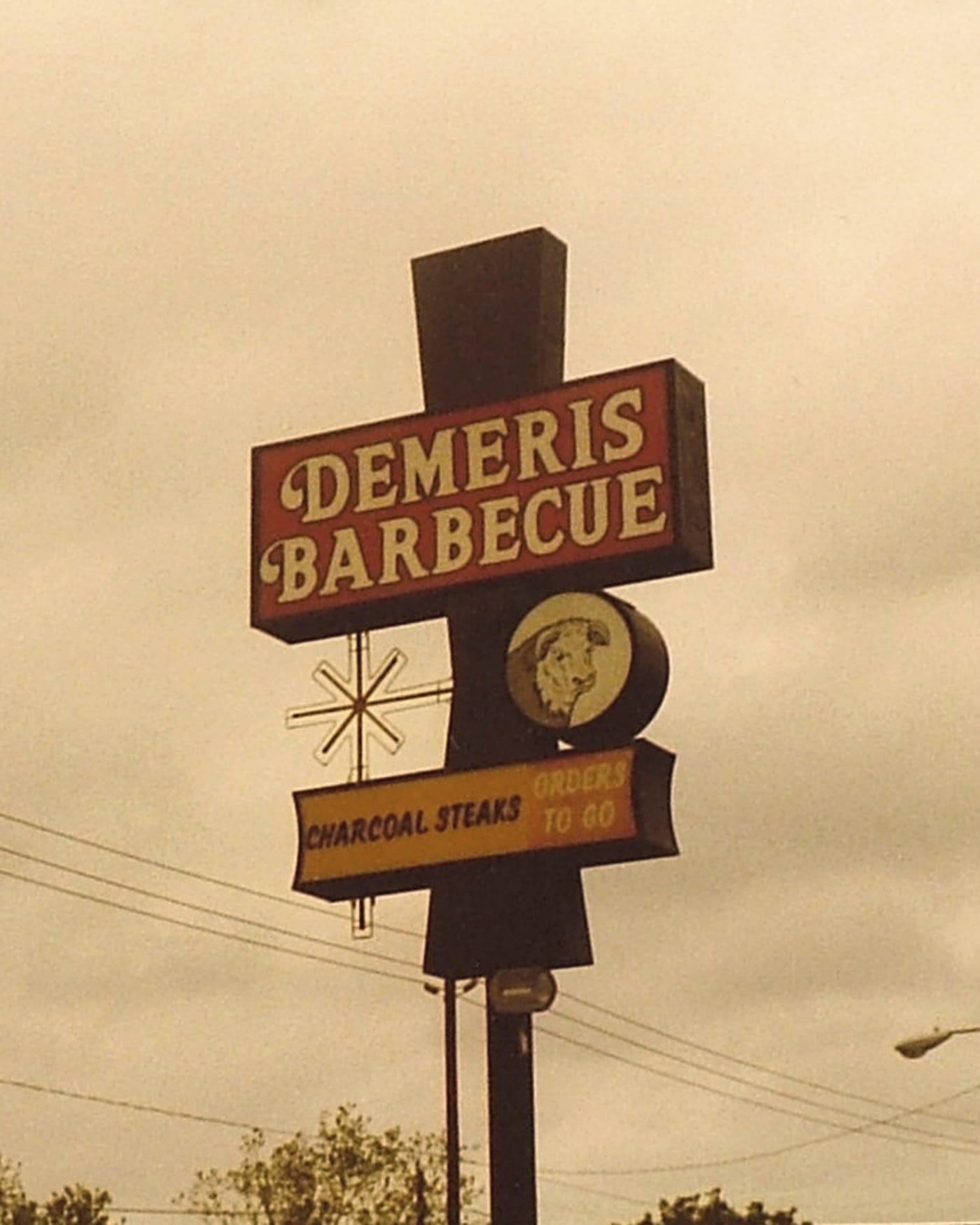 The original Demeris Barbecue neon sign reading Charcoal Steaks, Orders To Go