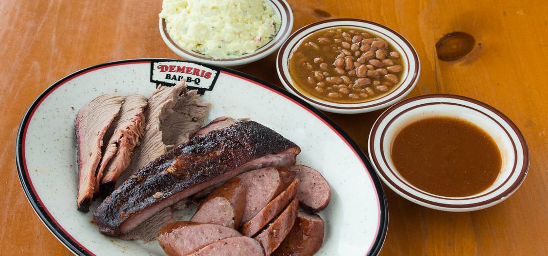 Three meat dinner with brisket, ribs and sausage plus beans and potato salad